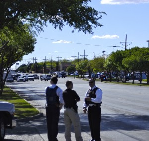 Lubbock Police officers handle the situation at City Bank on Wednesday. Photo By Colin Niebergall. 